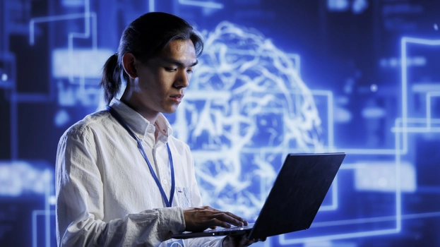 Engineer in server room uses device for artificial intelligence computing simulating human brain through self learning algorithms